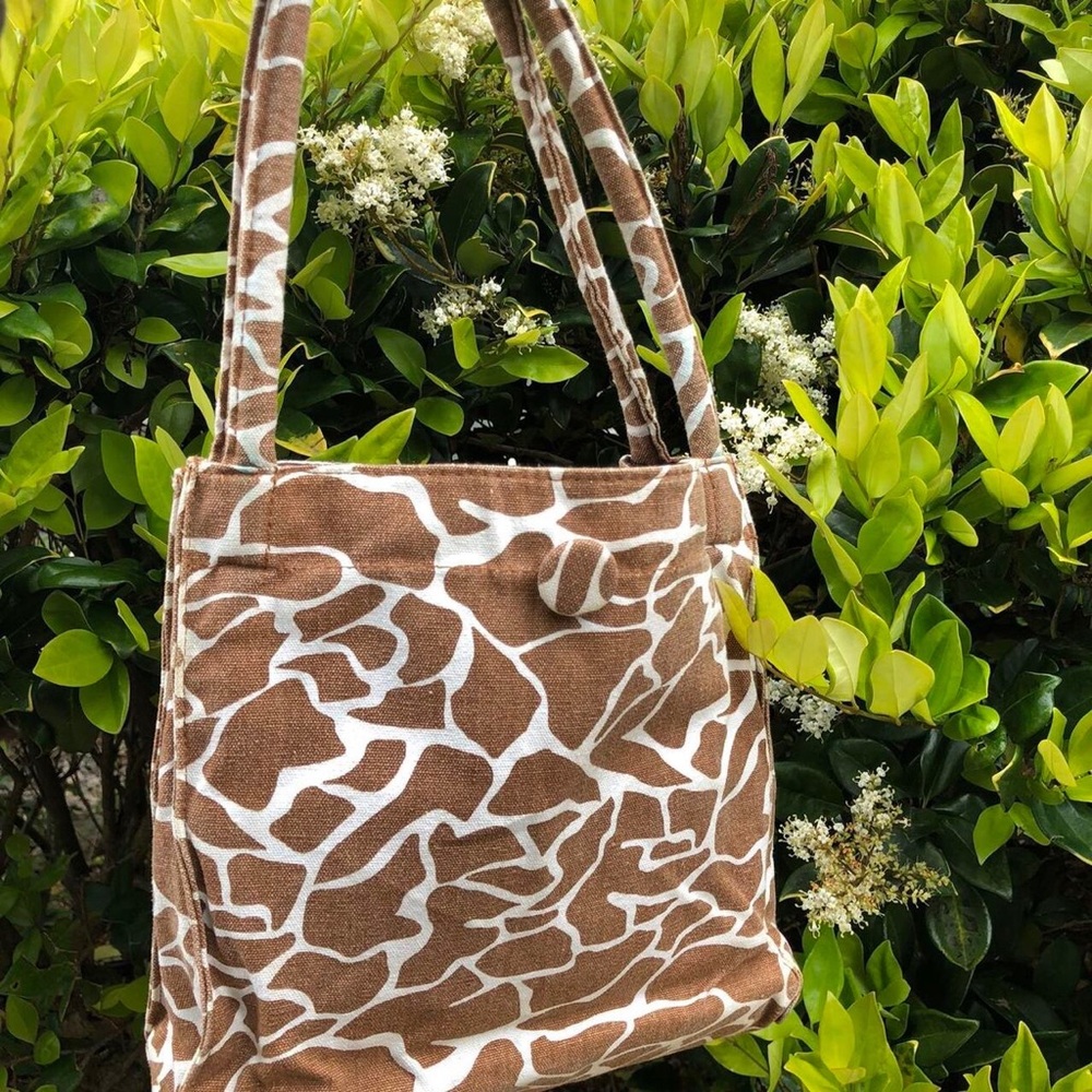 brown and white cow print purse